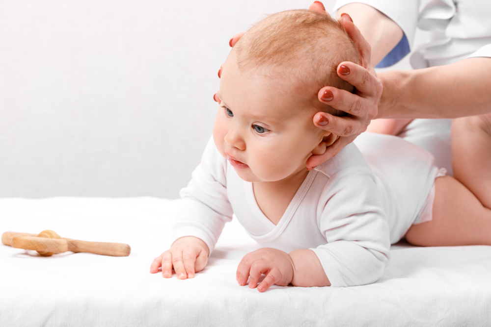 baby seeing a physical therapist as treatment for torticollis