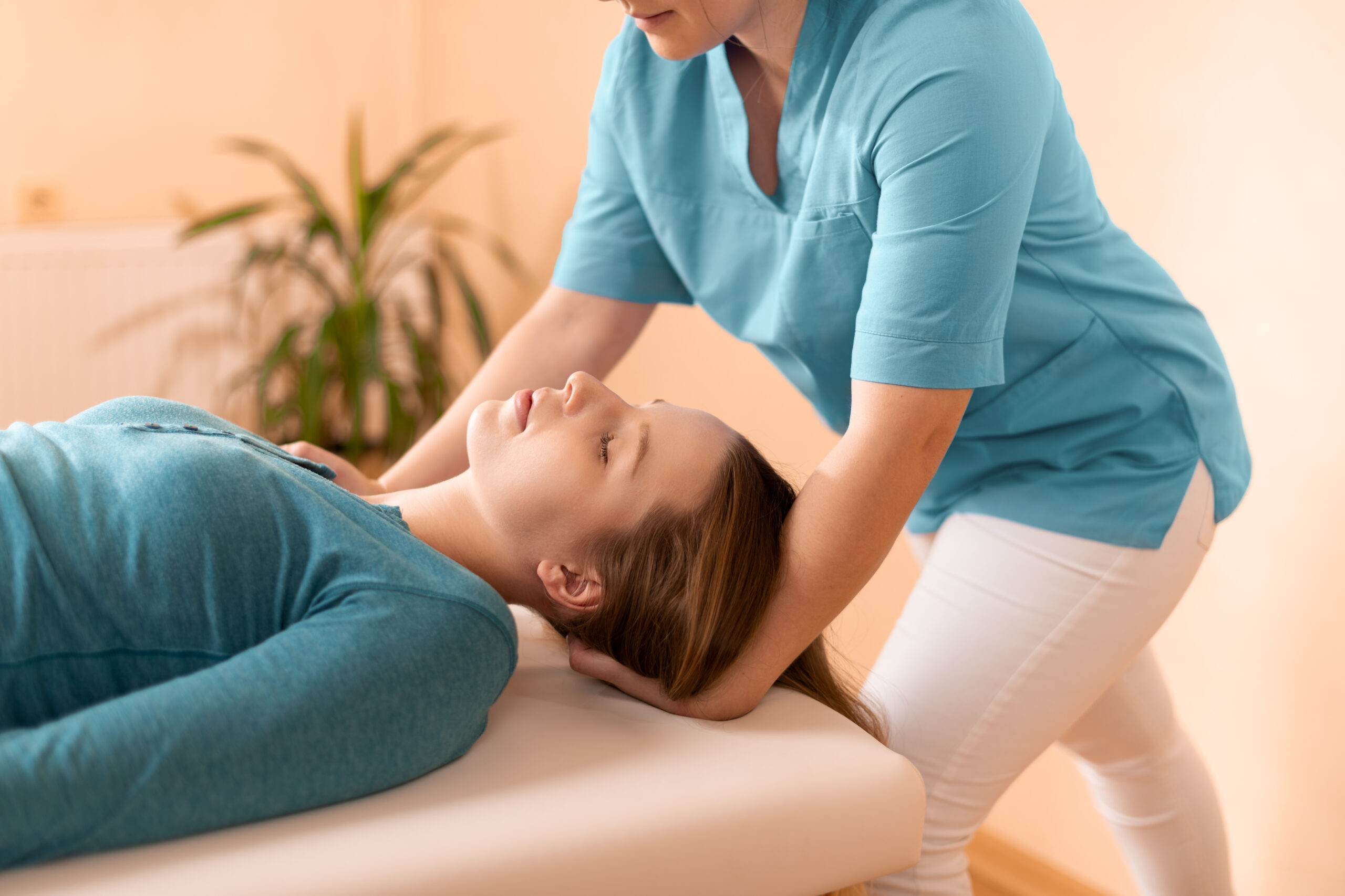 Physical therapist performs vestibular therapy on a patient