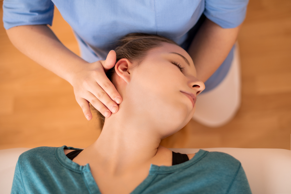 physical therapist using vestibular therapy for concussions on a patient