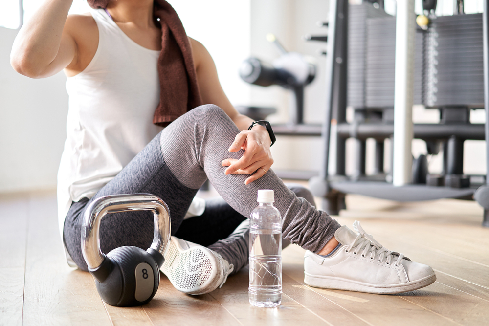woman suffering from upper back pain using low impact exercises to relieve pain